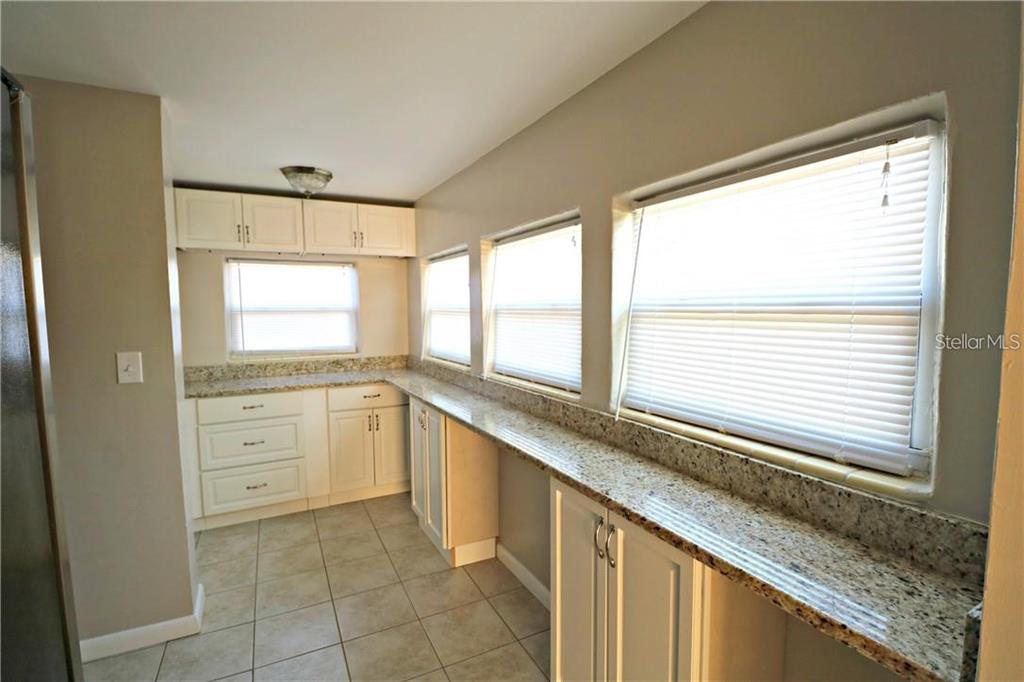 1222 St Anne Shrine Road Lake Wales, FL 33898 - Photo 9 of 14 a view of a kitchen with a sink and windows