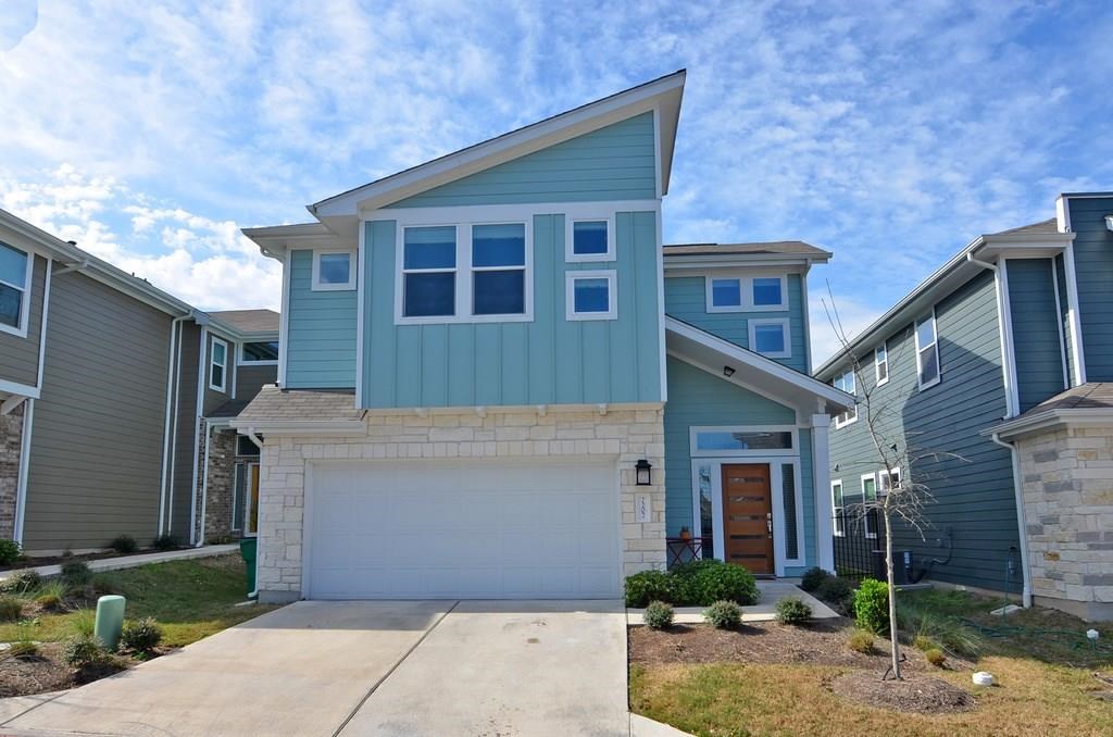 7207 Lysander Court Austin, TX 78741 - Photo 1 of 1 a front view of a house with a yard and garage