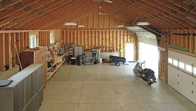 a room with lots of chairs and a chandelier