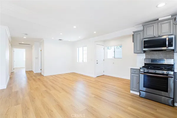 a view of kitchen with microwave and stove