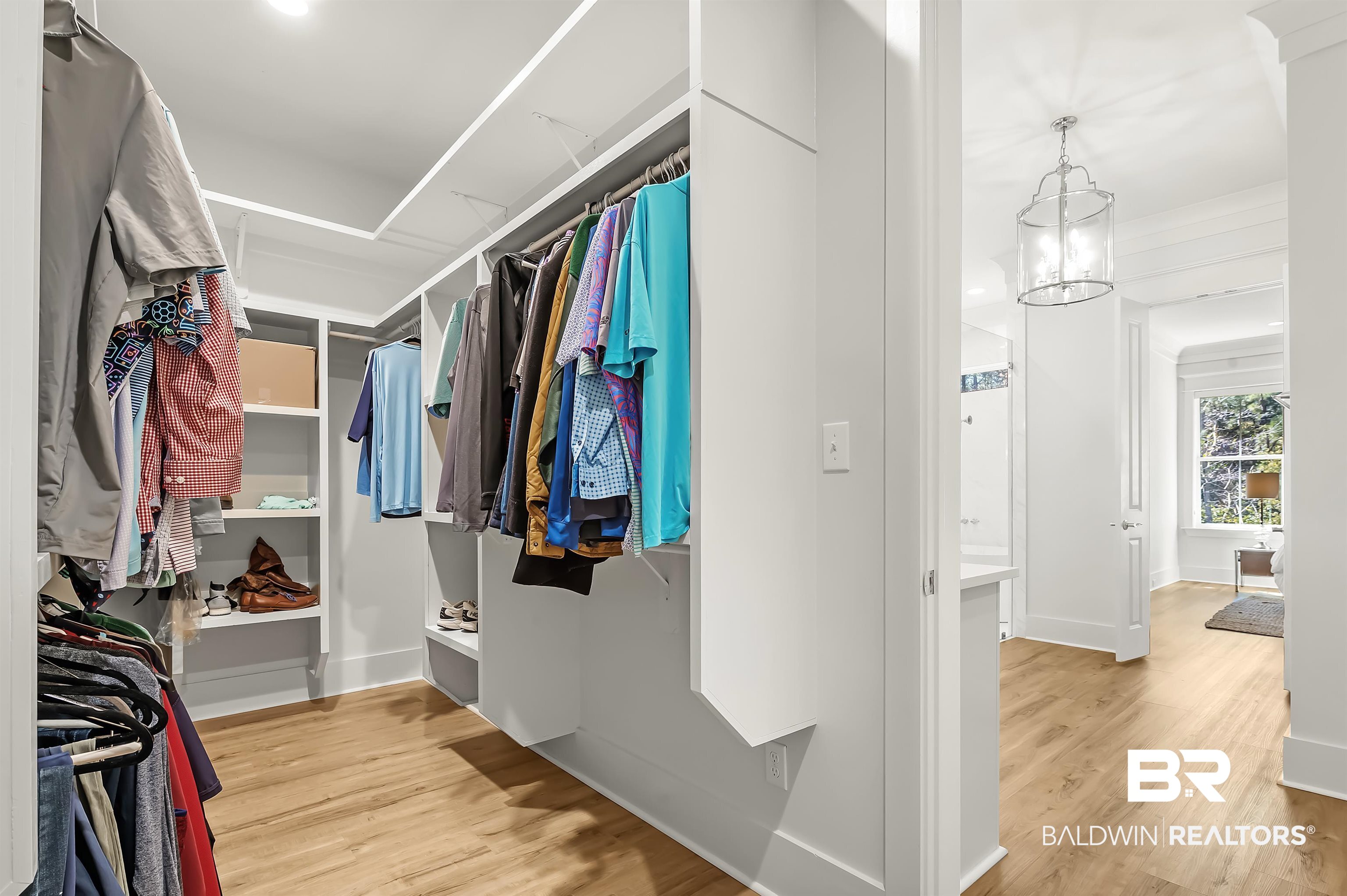 27888 Oakachoy Loop Daphne, AL 36526 - Photo 28 of 65 Spacious closet featuring a chandelier and light wood-type flooring