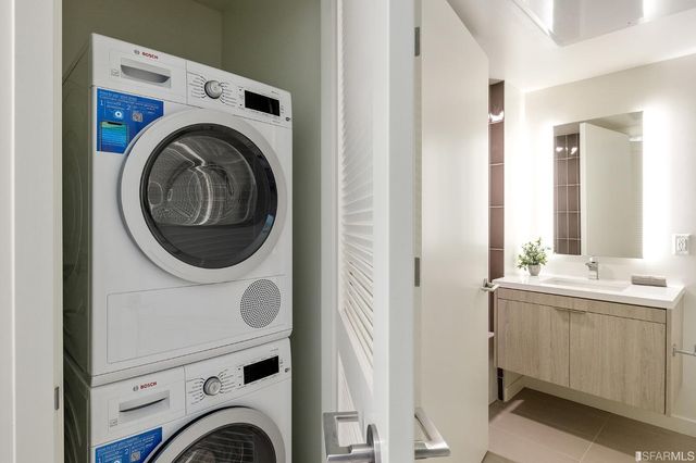 a bathroom with a bathtub a sink a vanity and a shower