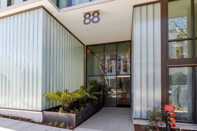 a view of staircase going to roof with metal railing and plants