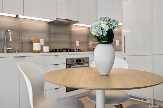 a table with a dining table and chairs