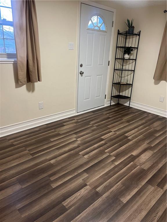 3887 Delco Road Brentwood, PA 15227 - Photo 4 of 14 en empty room with wooden floor and window