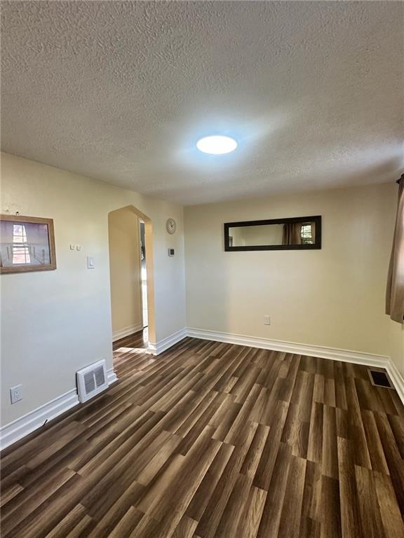 3887 Delco Road Brentwood, PA 15227 - Photo 5 of 14 a view of an empty room with wooden floor