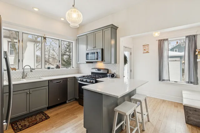 a kitchen with a sink stove and refrigerator