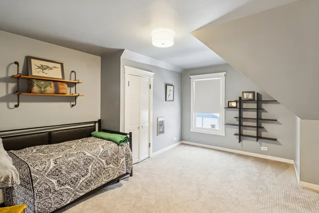 a bedroom with a bed and cabinets