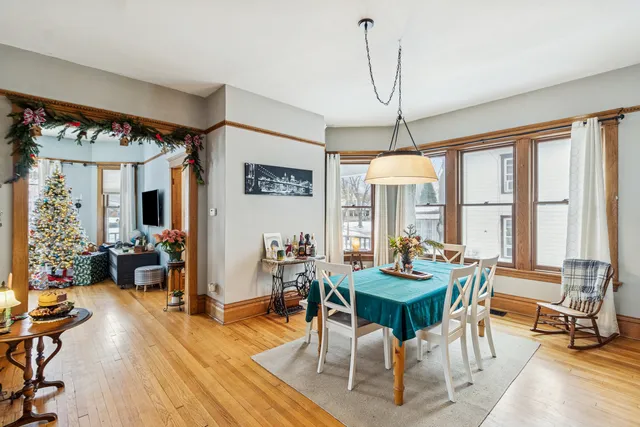 a living room with furniture a table and chairs