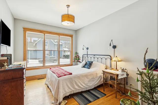 a bedroom with a bed and a television