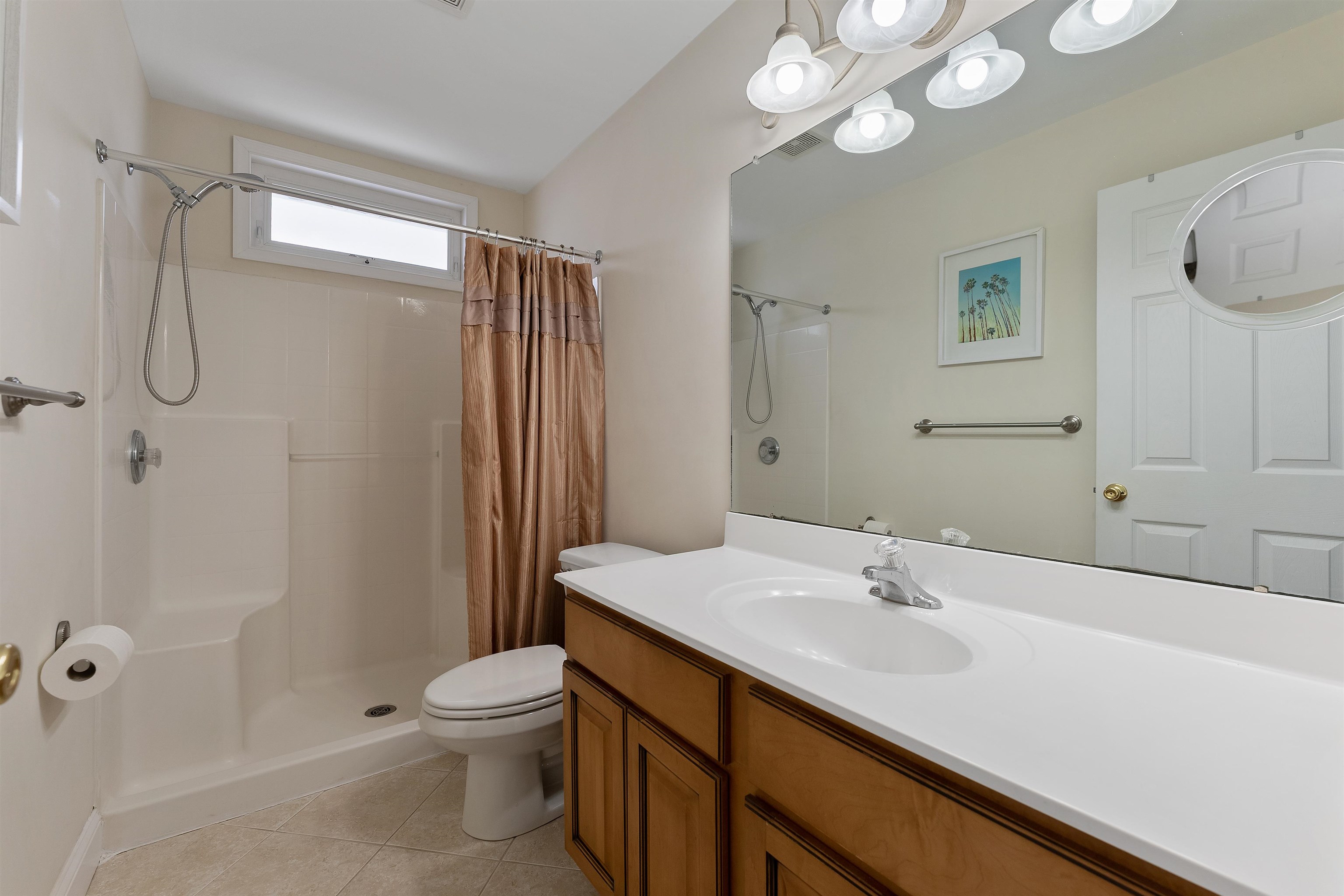 33 74th Street, Unit WEST Sea Isle City, NJ 08243 - Photo 23 of 48 a bathroom with a sink a toilet and shower