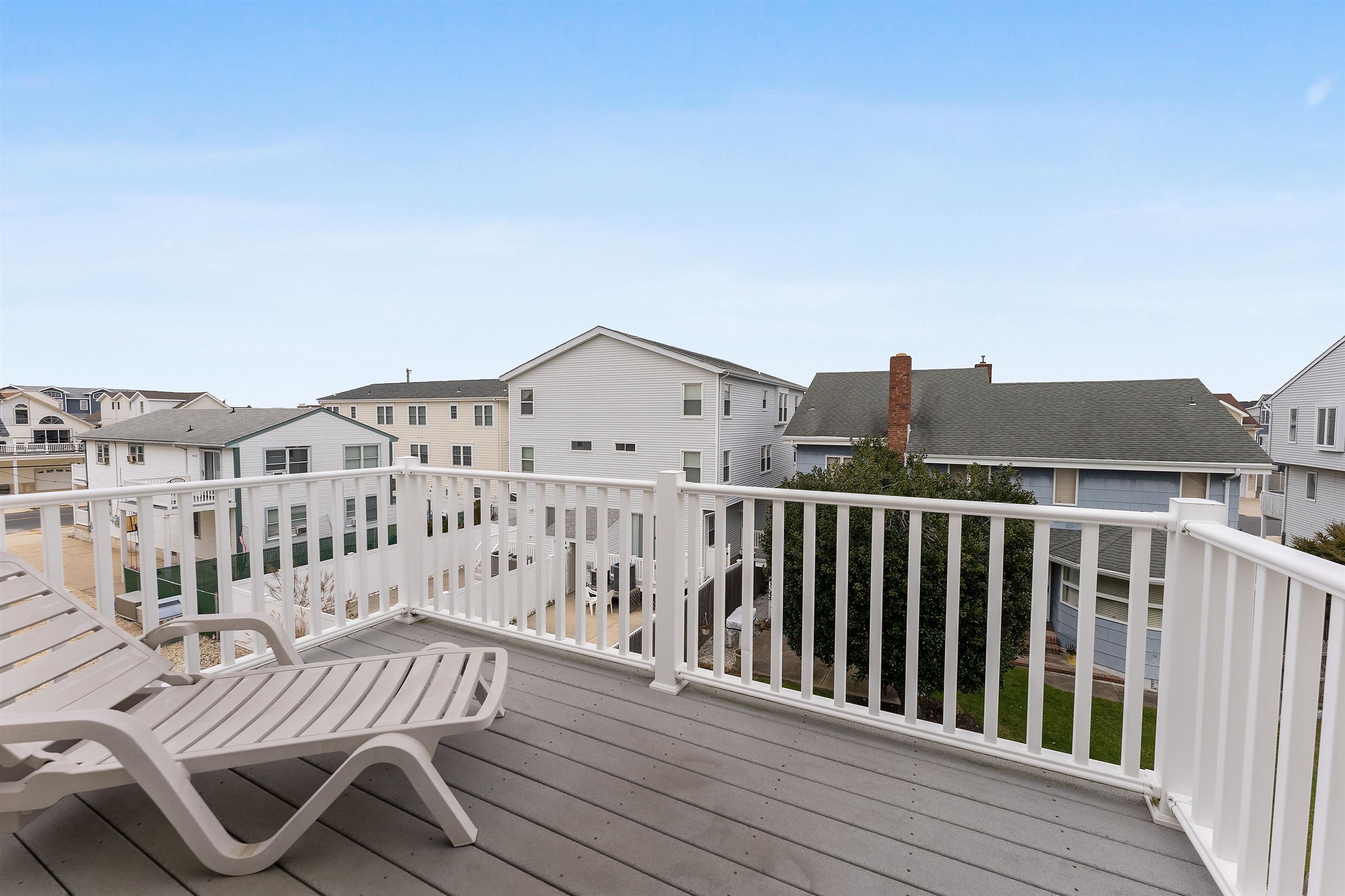 33 74th Street, Unit WEST Sea Isle City, NJ 08243 - Photo 25 of 48 a view of a roof deck with wooden floor and fence