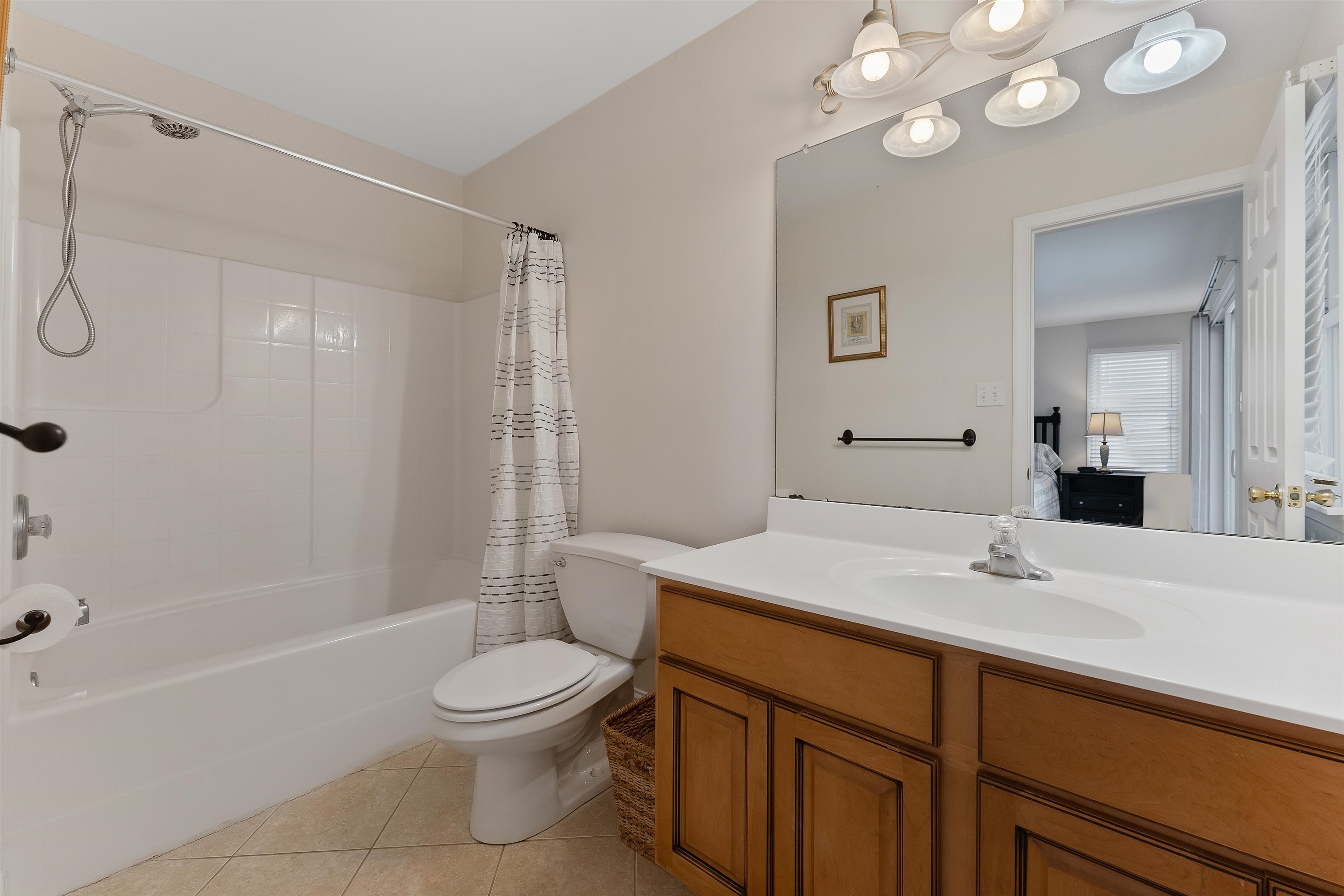 33 74th Street, Unit WEST Sea Isle City, NJ 08243 - Photo 28 of 48 a bathroom with a sink a toilet and shower