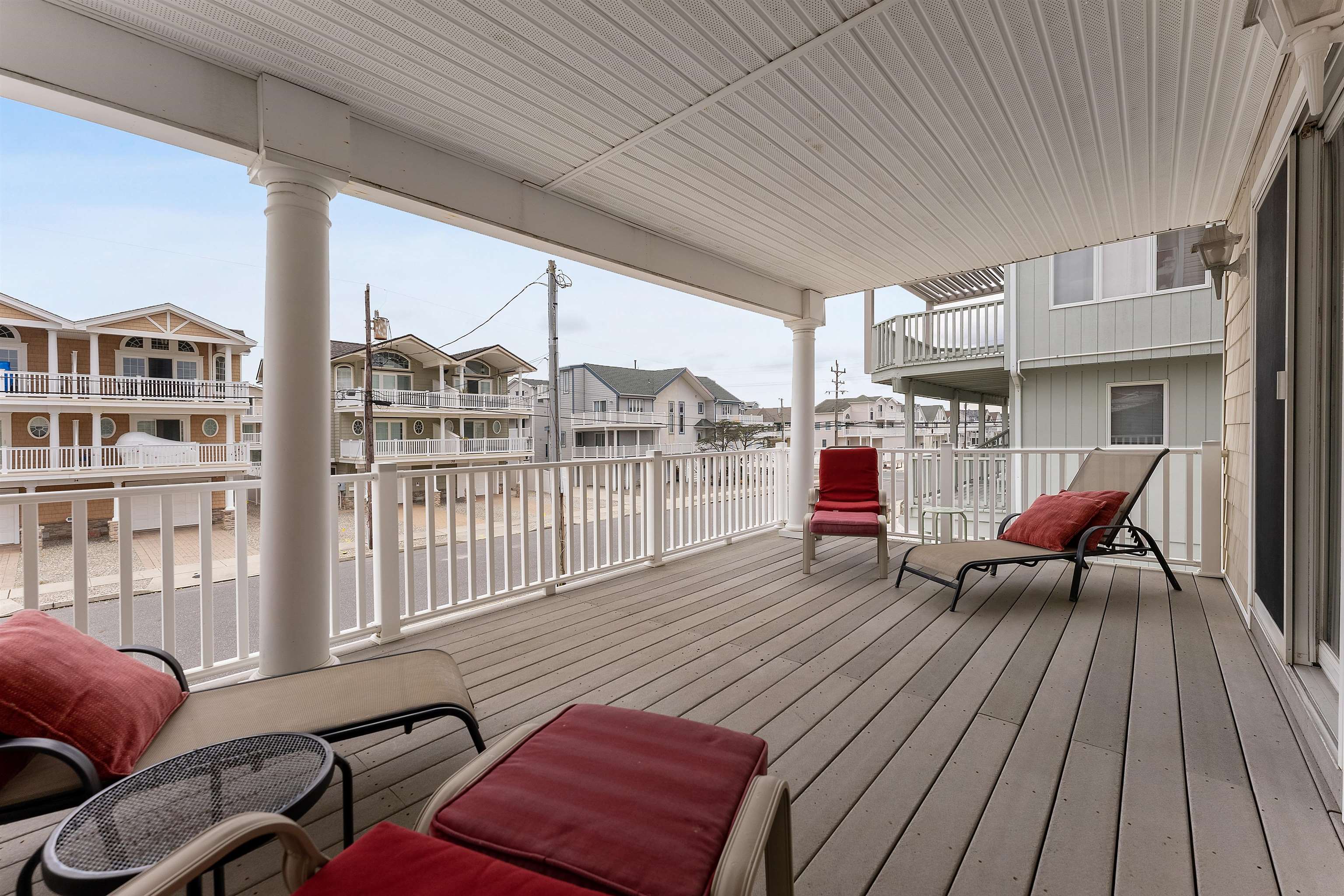 33 74th Street, Unit WEST Sea Isle City, NJ 08243 - Photo 30 of 48 a living room filled with furniture hardwood floor and a table