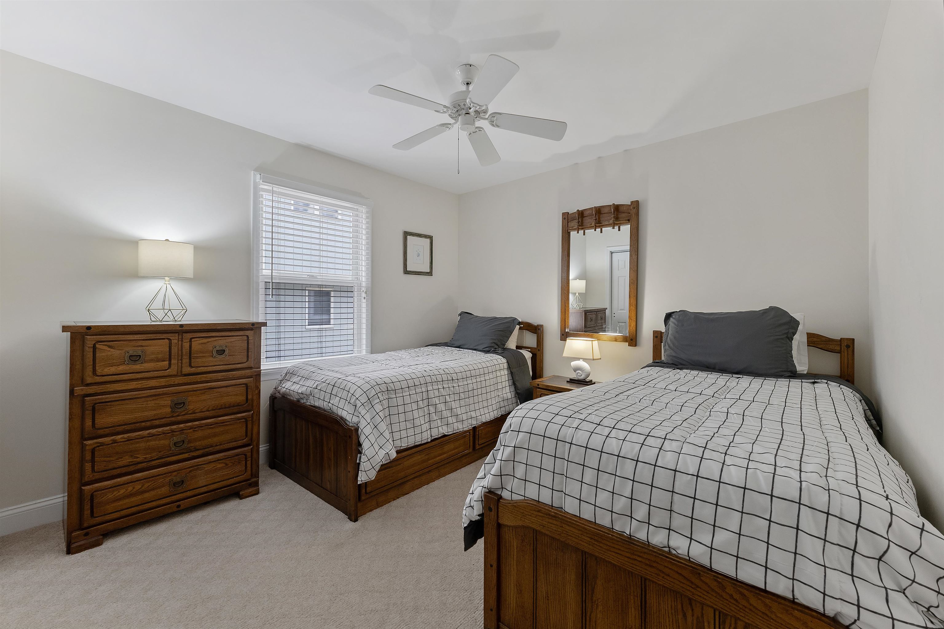 33 74th Street, Unit WEST Sea Isle City, NJ 08243 - Photo 32 of 48 a bedroom with two beds and painting on the wall