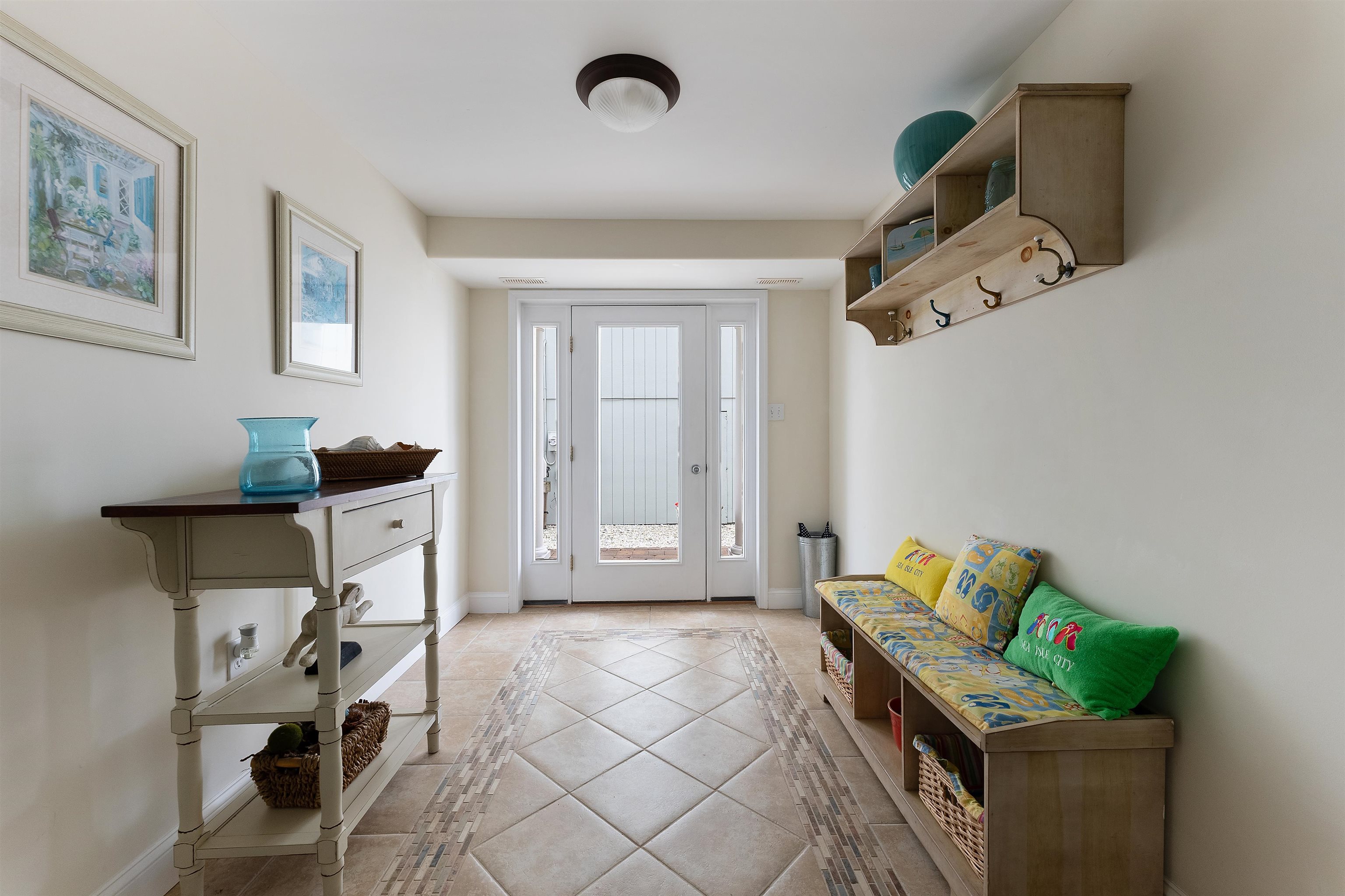 33 74th Street, Unit WEST Sea Isle City, NJ 08243 - Photo 41 of 48 a bedroom with furniture and a window