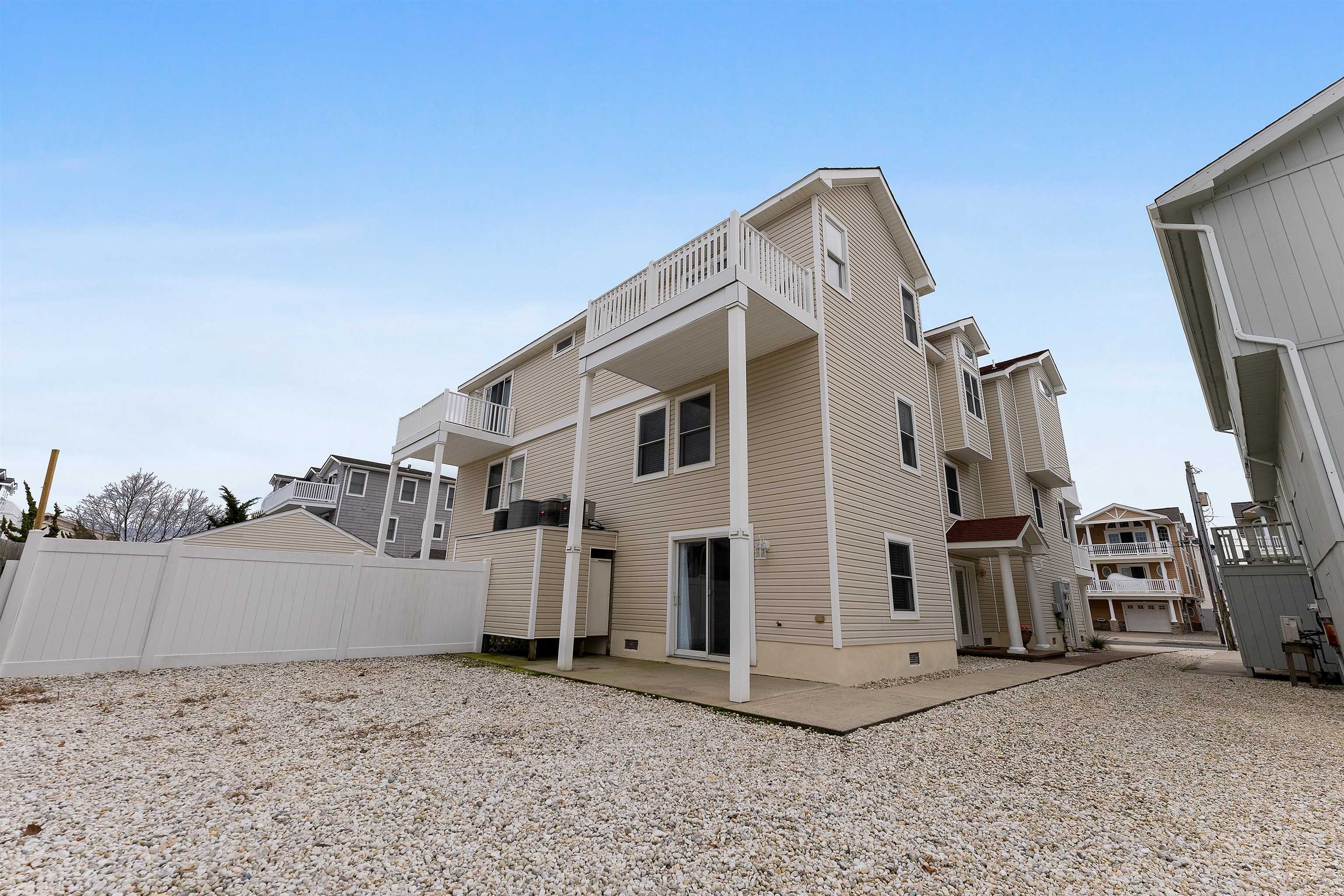 33 74th Street, Unit WEST Sea Isle City, NJ 08243 - Photo 45 of 48 a view of a house with roof