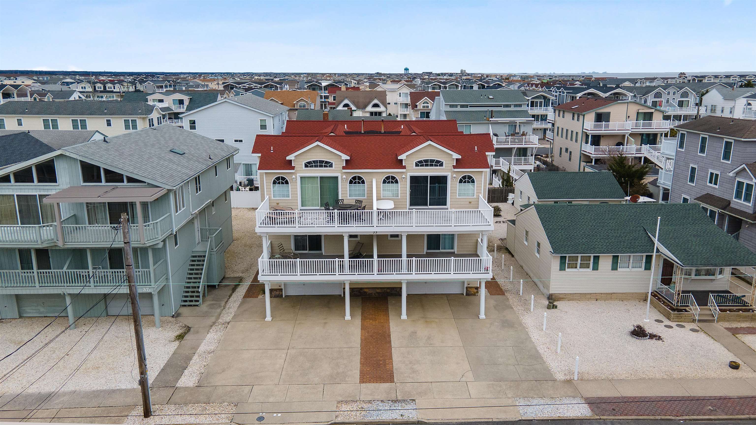 33 74th Street, Unit WEST Sea Isle City, NJ 08243 - Photo 46 of 48 an aerial view of a house with a garden