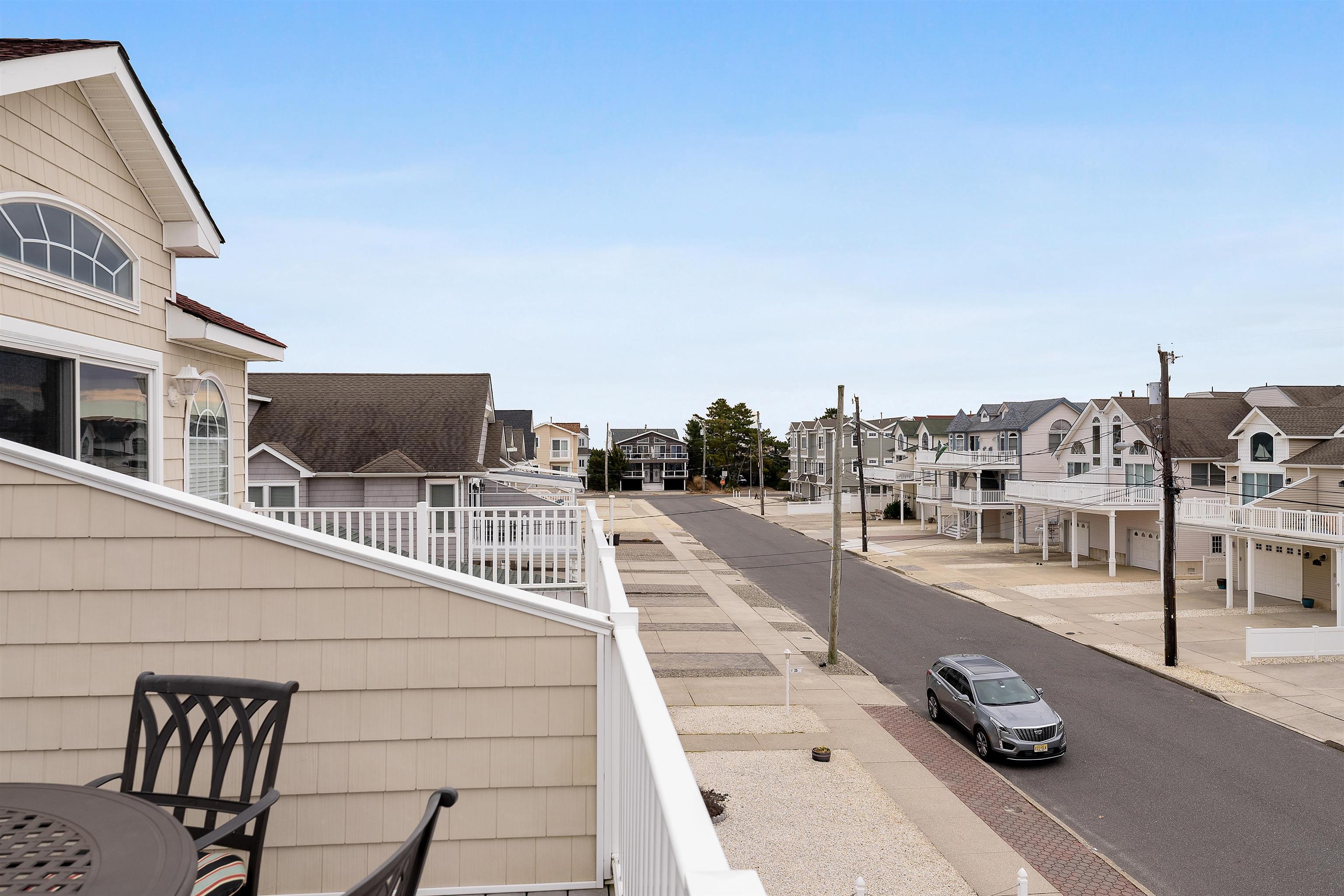 33 74th Street, Unit WEST Sea Isle City, NJ 08243 - Photo 9 of 48 a view of a city from a balcony