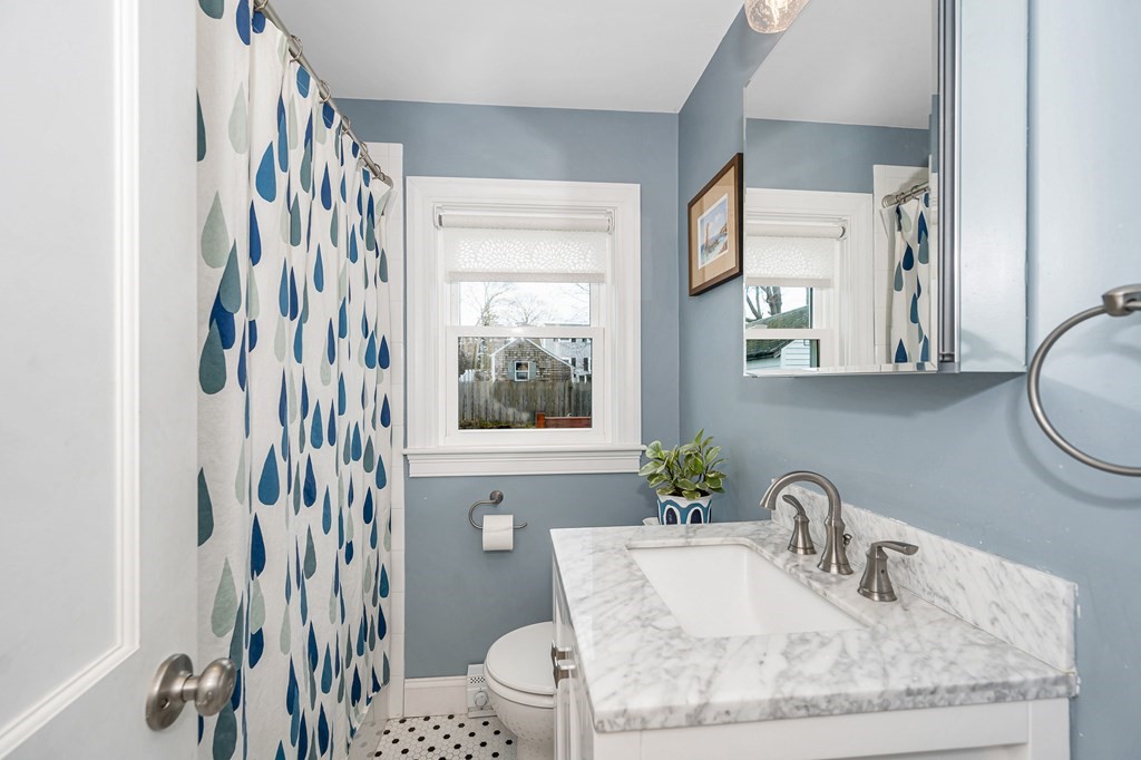 19 Curtis Road Saugus, MA 01906 - Photo 12 of 36 a bathroom with a granite countertop sink and a mirror