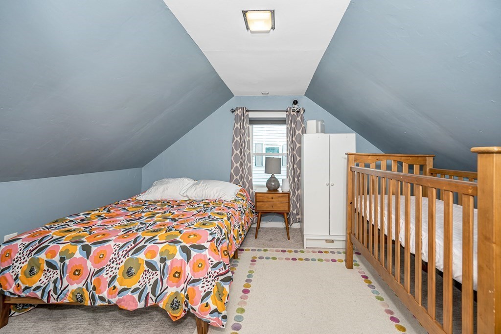 19 Curtis Road Saugus, MA 01906 - Photo 17 of 36 a bedroom with a bed and a window