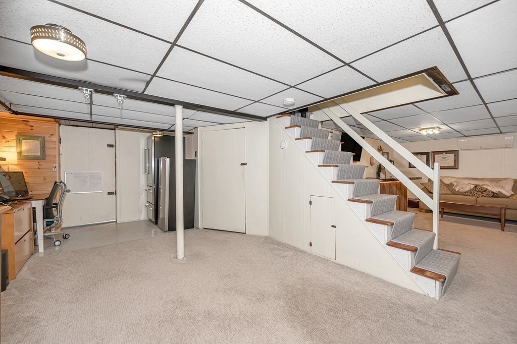 19 Curtis Road Saugus, MA 01906 - Photo 26 of 36 a view of an empty room with stairs
