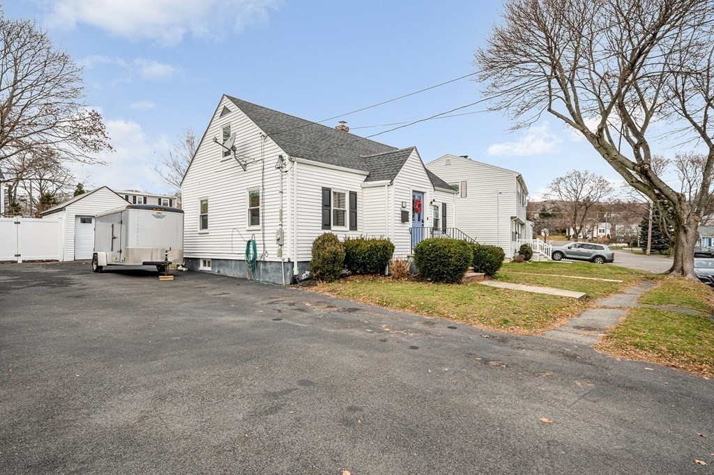 19 Curtis Road Saugus, MA 01906 - Photo 27 of 36 a view of white house with a big yard and large trees