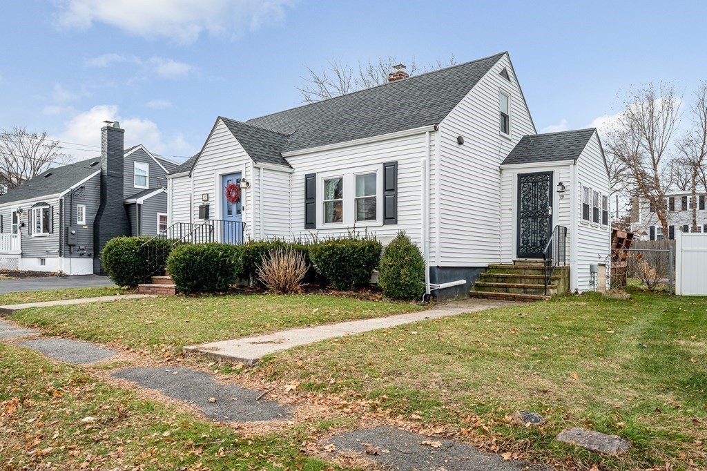 19 Curtis Road Saugus, MA 01906 - Photo 29 of 36 a view of a house with a yard and plants