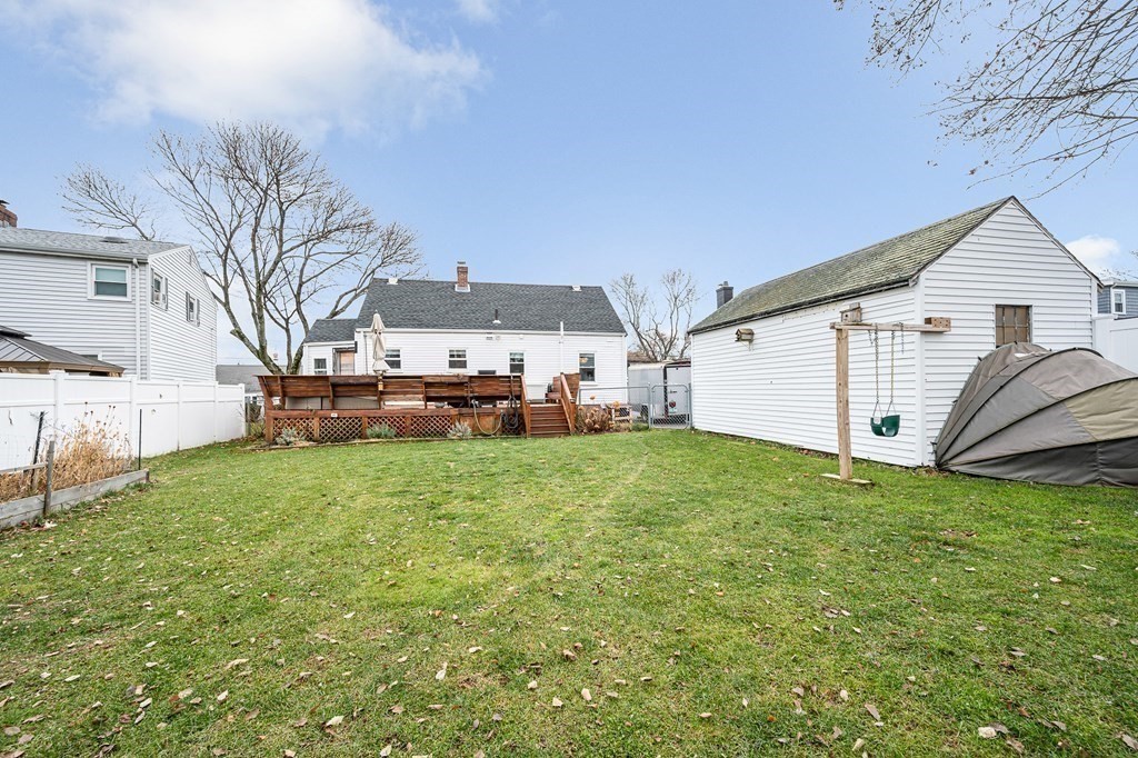 19 Curtis Road Saugus, MA 01906 - Photo 33 of 36 a view of a house with a backyard