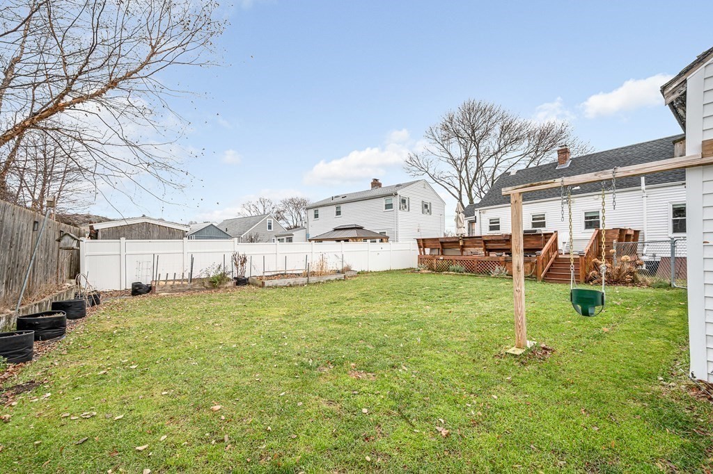 19 Curtis Road Saugus, MA 01906 - Photo 34 of 36 a backyard of a house with table and chairs