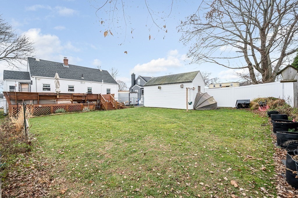 19 Curtis Road Saugus, MA 01906 - Photo 35 of 36 a view of a house with a back yard