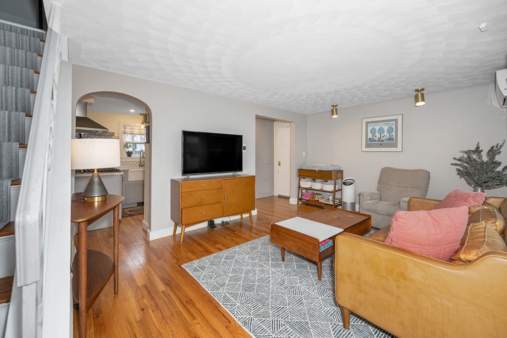 19 Curtis Road Saugus, MA 01906 - Photo 4 of 36 a living room with furniture and a flat screen tv