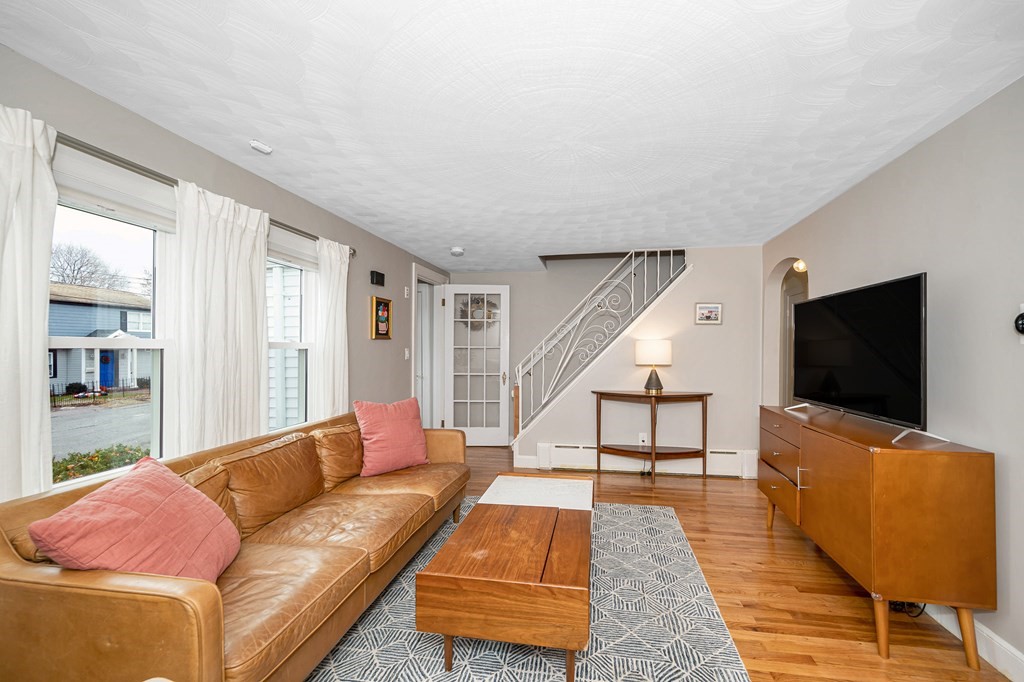 19 Curtis Road Saugus, MA 01906 - Photo 6 of 36 a living room with furniture and a flat screen tv
