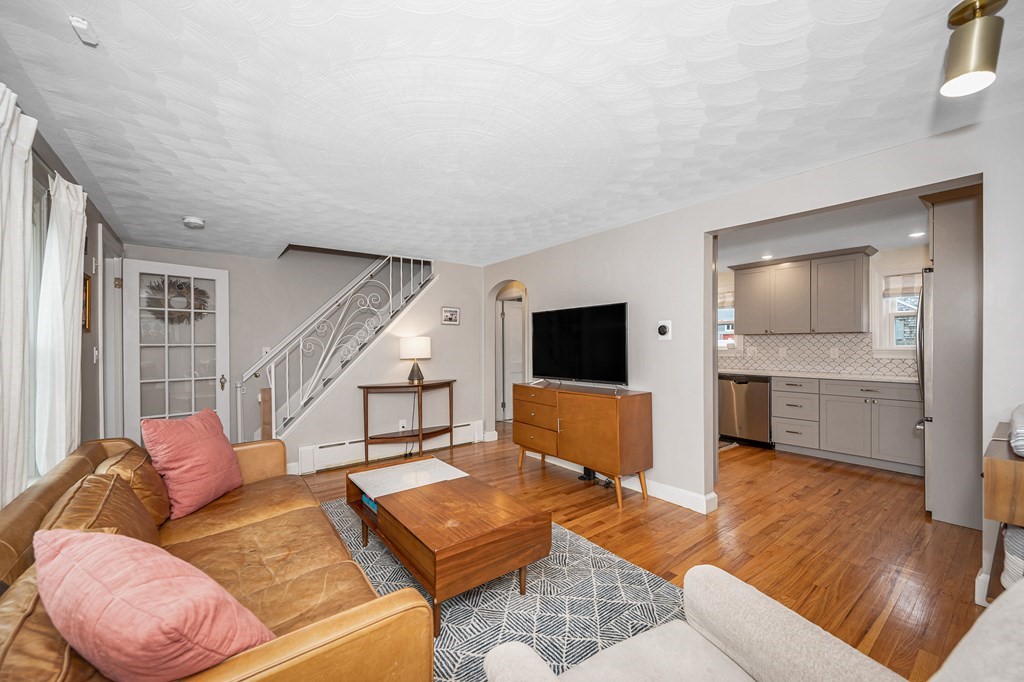 19 Curtis Road Saugus, MA 01906 - Photo 7 of 36 a living room with furniture and a flat screen tv