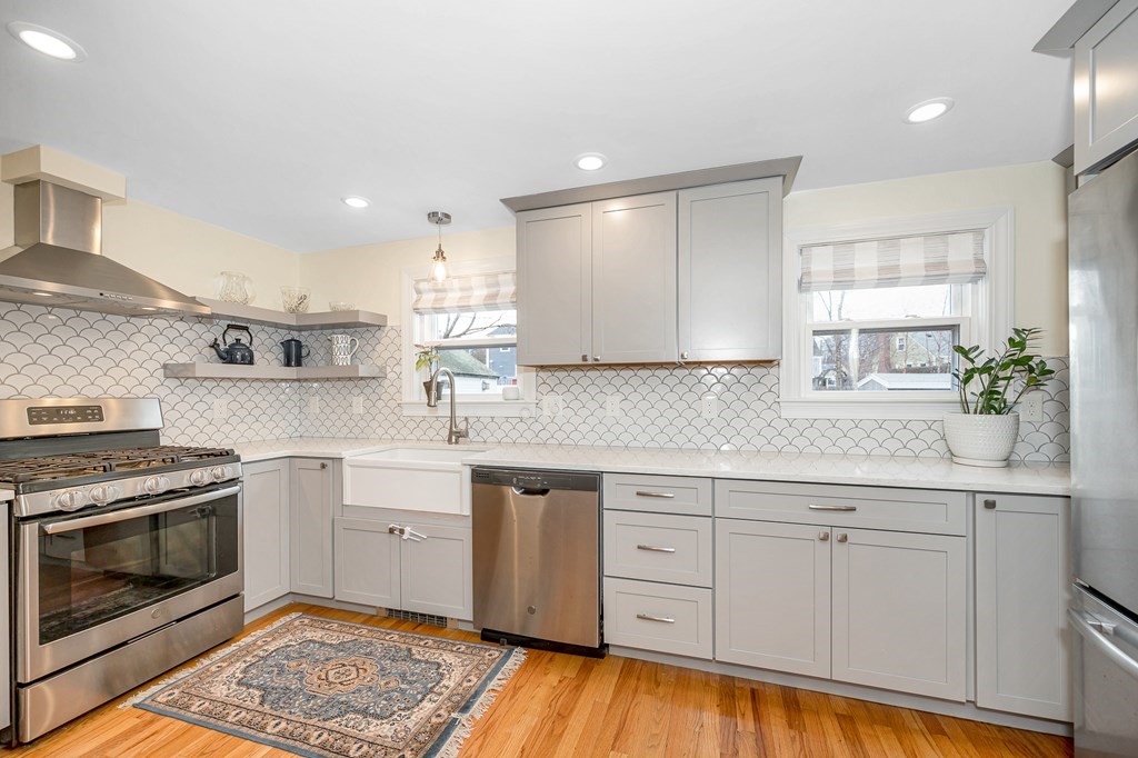 19 Curtis Road Saugus, MA 01906 - Photo 8 of 36 a kitchen with white cabinets appliances and a sink