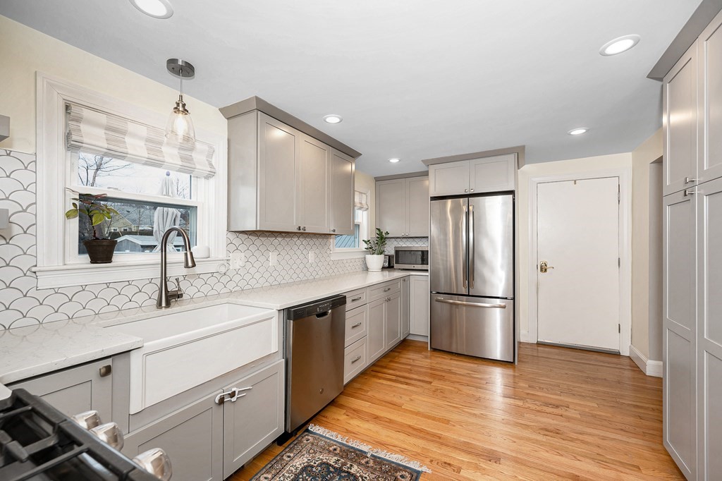 19 Curtis Road Saugus, MA 01906 - Photo 9 of 36 a kitchen with a sink stainless steel appliances and cabinets