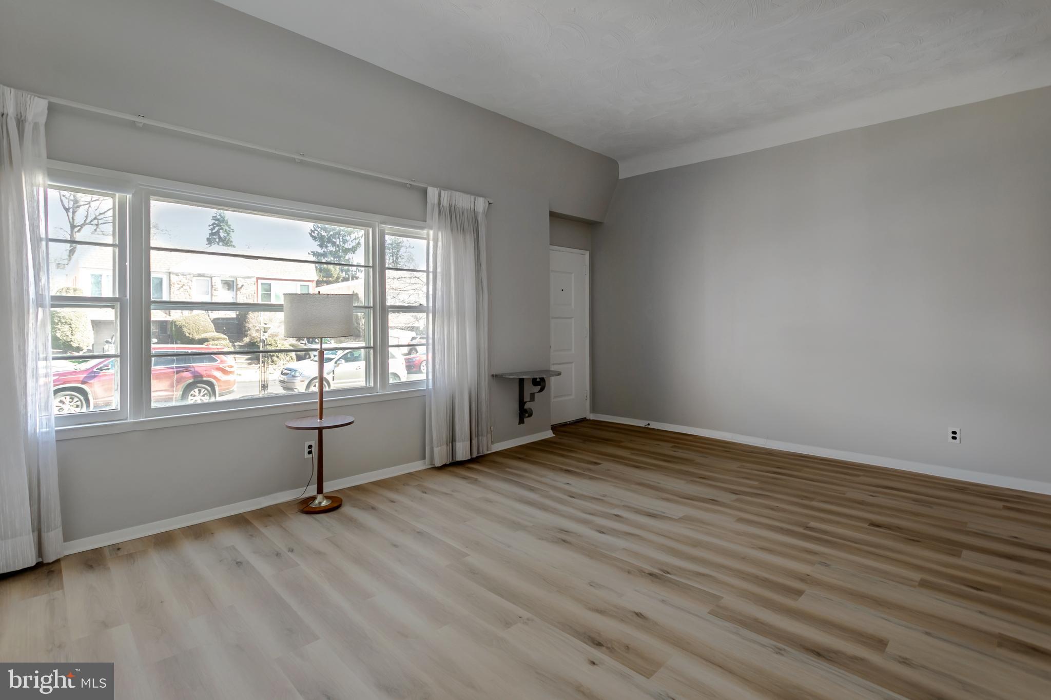 138 Juniper Road Havertown, PA 19083 - Photo 4 of 29 wooden floor in an empty room with a window