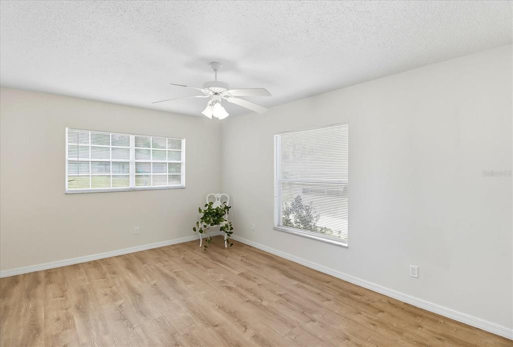 305 Edison Street Inverness, FL 34452 - Photo 20 of 44 an empty room with windows and fan
