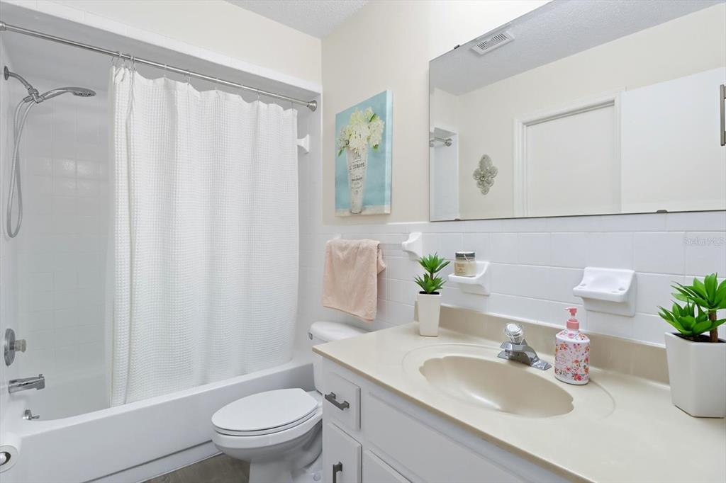 305 Edison Street Inverness, FL 34452 - Photo 27 of 44 a bathroom with a sink toilet and shower