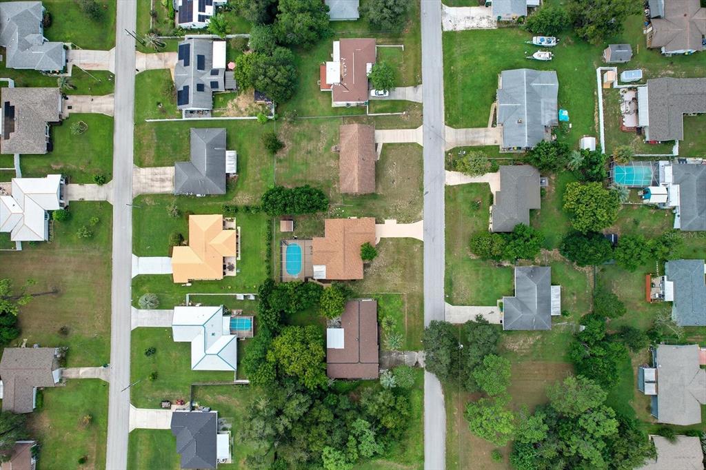 305 Edison Street Inverness, FL 34452 - Photo 43 of 44 an aerial view of multiple houses with a yard