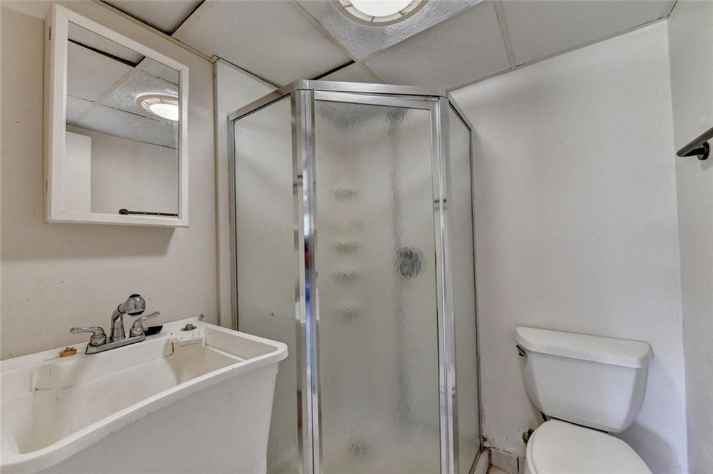 1577 Harbour Oaks Road Tucker, GA 30084 - Photo 47 of 58 a bathroom with a sink toilet and shower