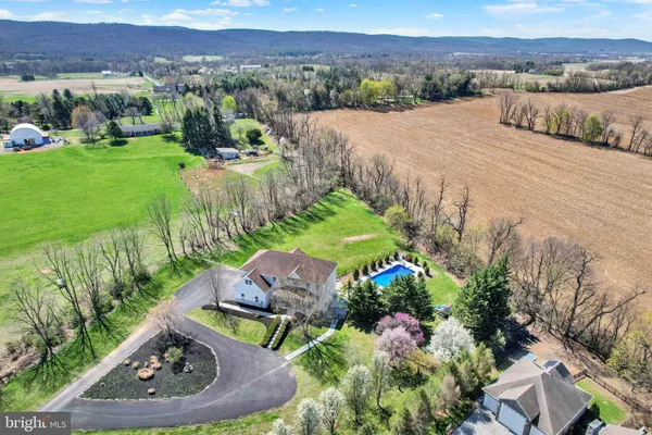 a large white kitchen with stainless steel appliances