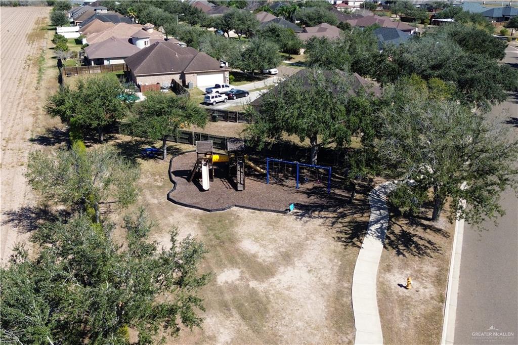 4505 Resaca S Street Harlingen, TX 78552 - Photo 9 of 10 an aerial view of a house with outdoor space and trees all around