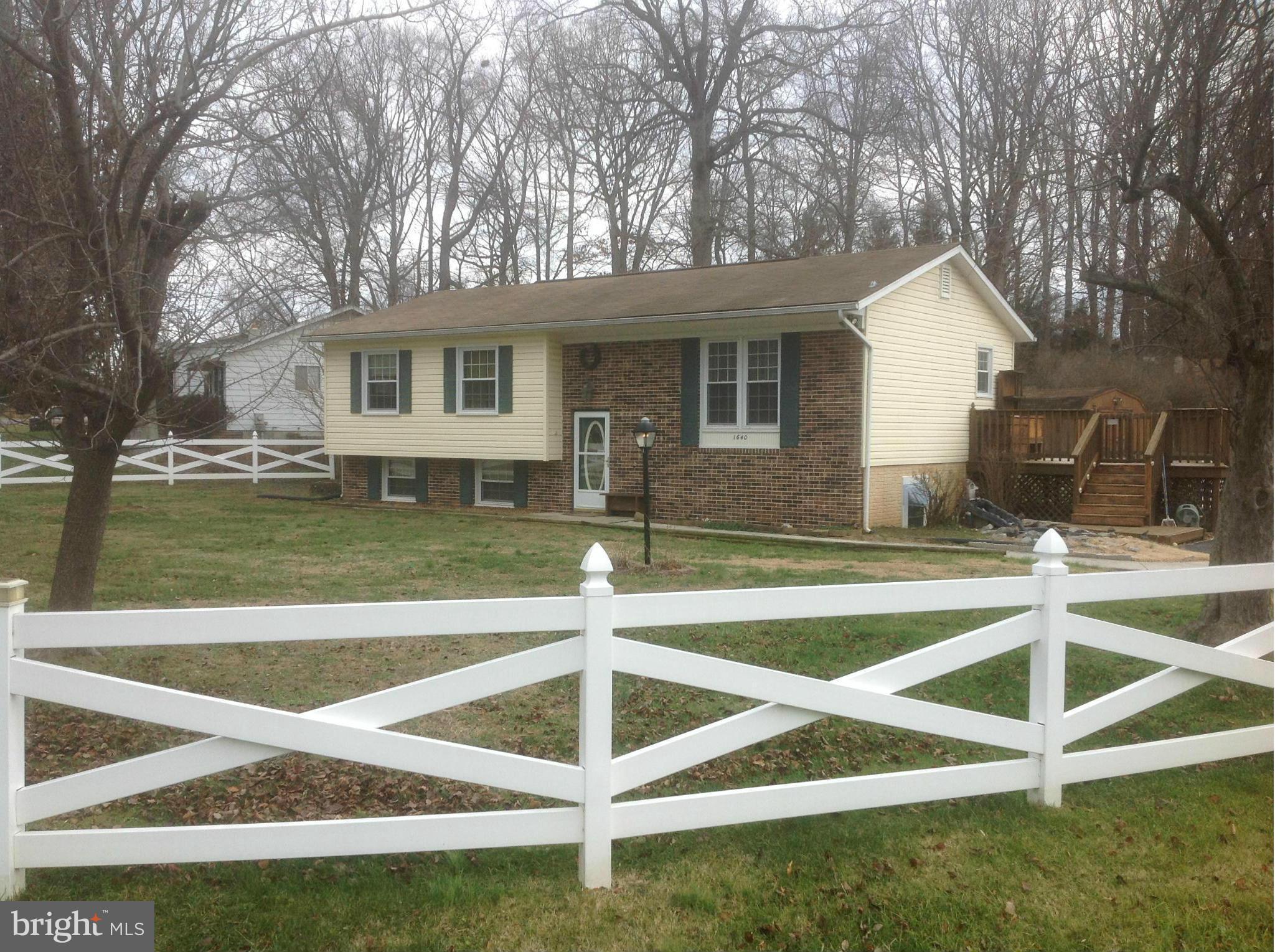 1640 Gibbons Road Point of Rocks, MD 21777 - Photo 1 of 20 a view of a house with a backyard and a tree