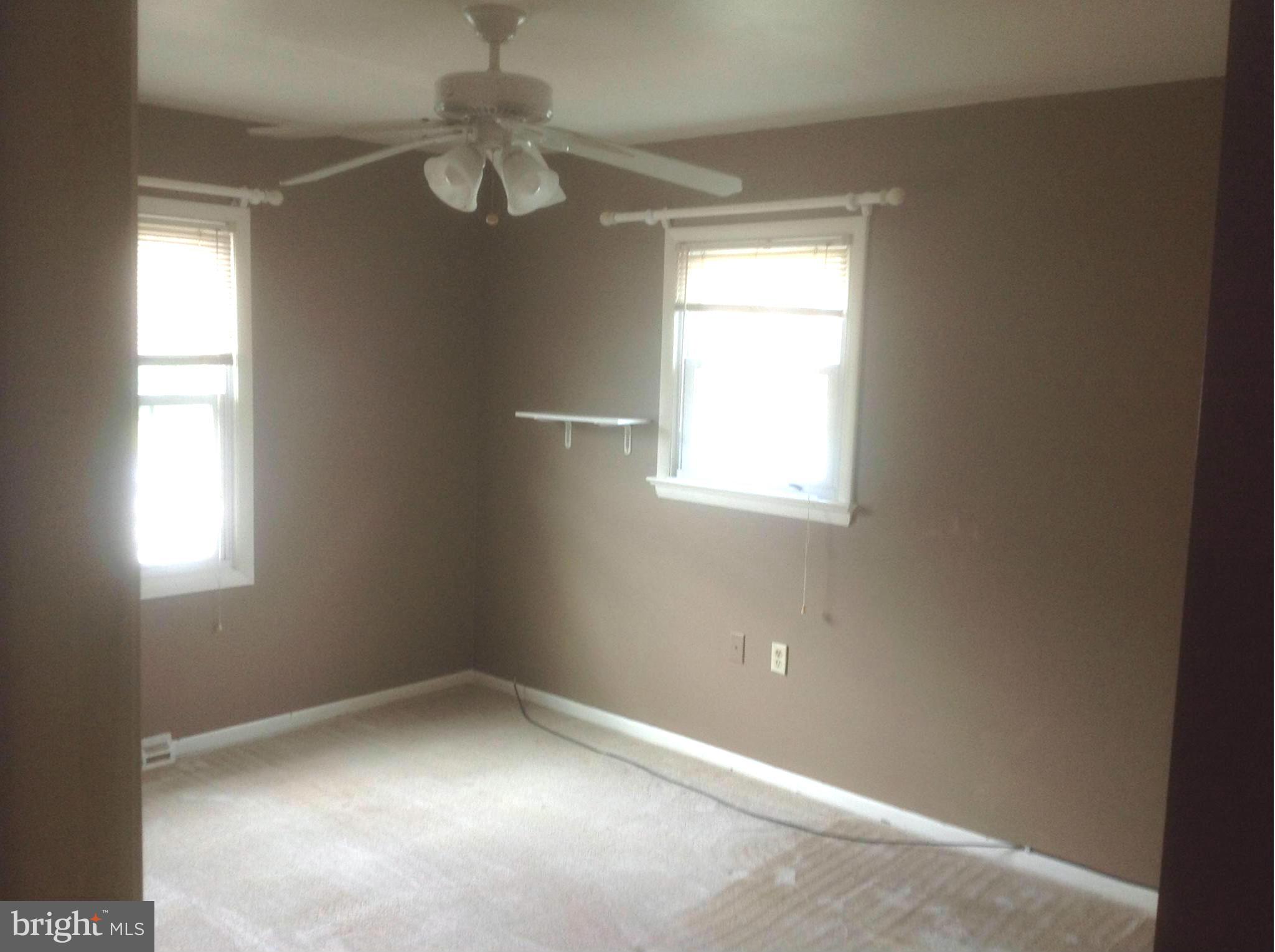 1640 Gibbons Road Point of Rocks, MD 21777 - Photo 11 of 20 an empty room with windows and fan