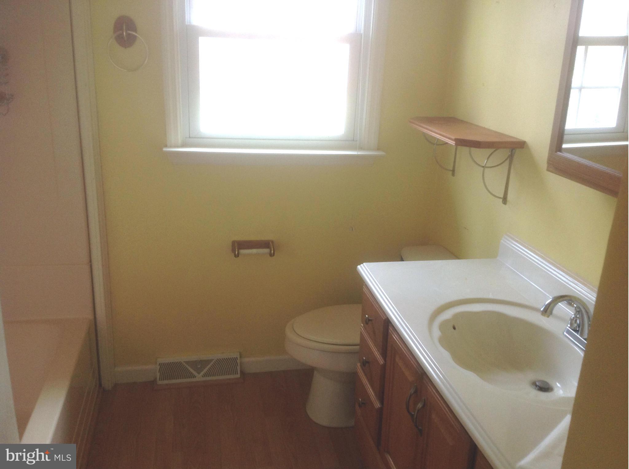 1640 Gibbons Road Point of Rocks, MD 21777 - Photo 12 of 20 a white toilet sitting next to a bathroom sink