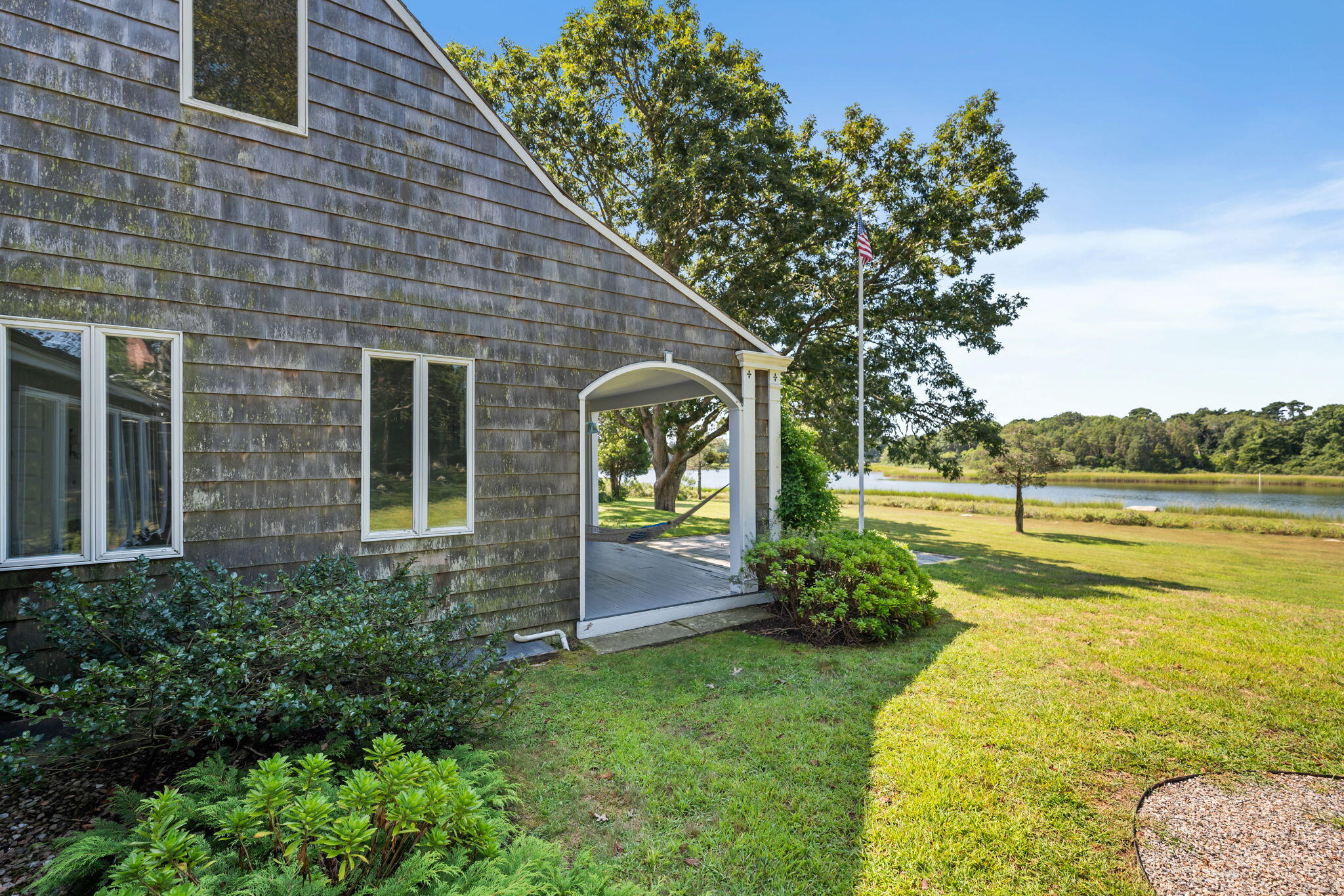 32 Chapoquoit Road Falmouth, MA 02540 - Photo 7 of 50 end of porch and harbor