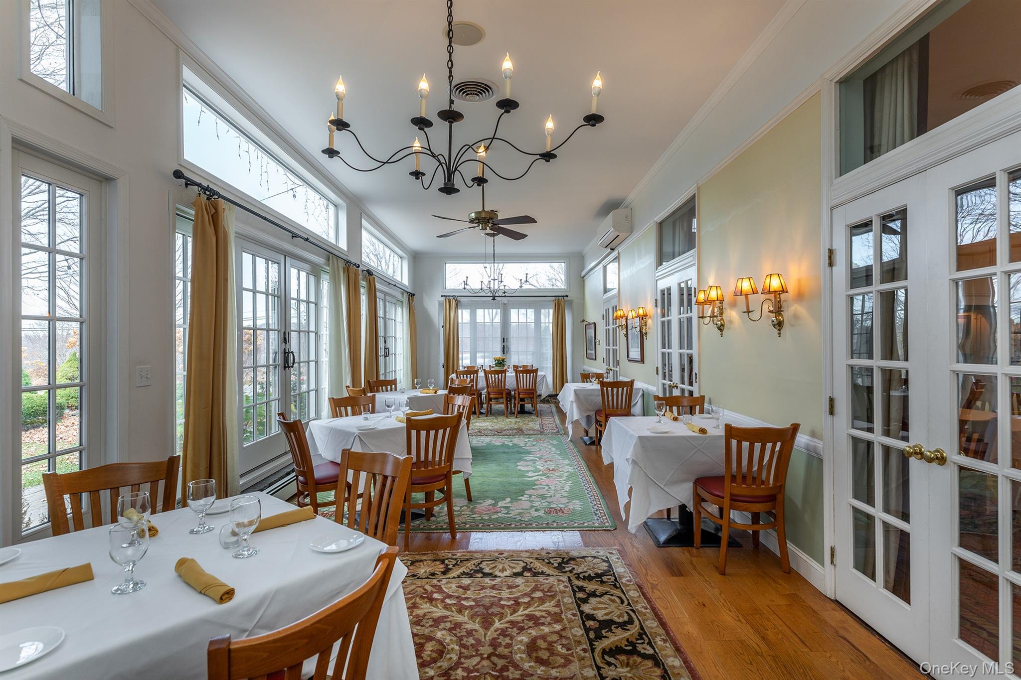 4258 Highway 44 Millbrook, NY 12545 - Photo 17 of 36 a view of a dining room with furniture window and wooden floor