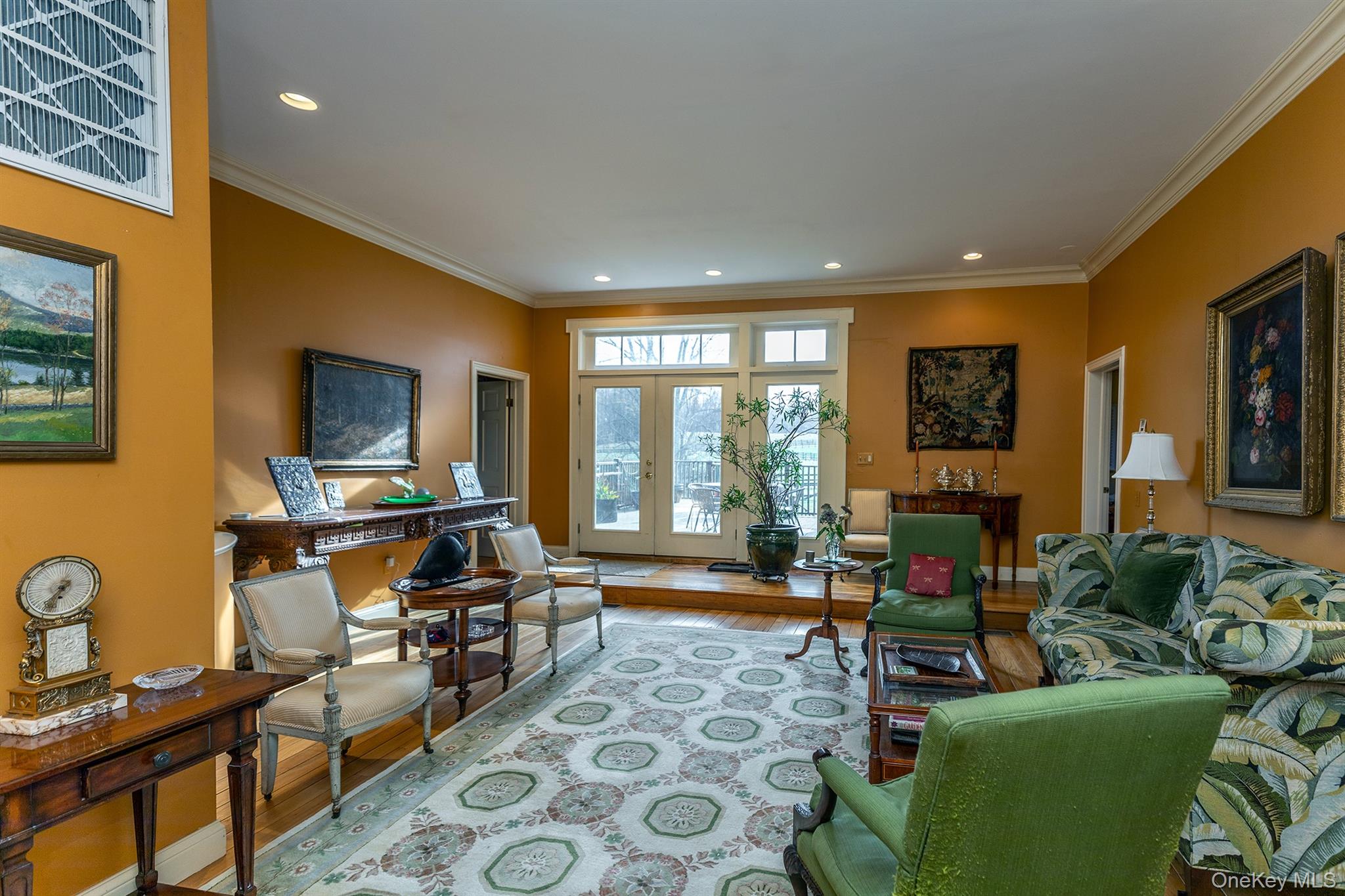 4258 Highway 44 Millbrook, NY 12545 - Photo 30 of 36 a living room with furniture a flat screen tv and a floor to ceiling window