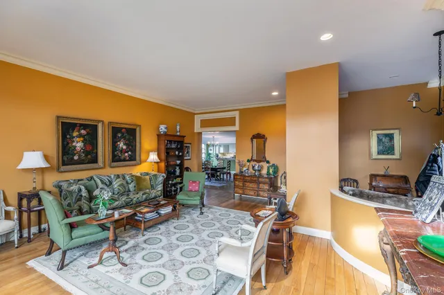 a living room with furniture a rug and a flat screen tv